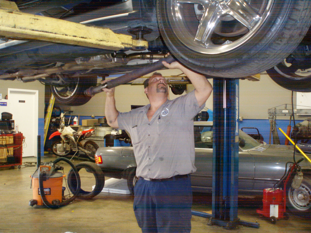 Scott Wennersten repairing vehicle
